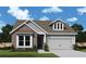 Charming single-Gathering home featuring a brick facade, well-maintained lawn, and a two-car garage at 1045 Pine Bark Ln, Canton, GA 30114