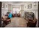 Relaxing living room design with dark leather chairs, bookshelves, and modern fixtures at 1045 Pine Bark Ln, Canton, GA 30114