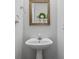 Bathroom featuring single sink and decorative mirror at 335 Lee Miller Ct, Suwanee, GA 30024