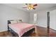 Cozy bedroom featuring a ceiling fan, and hardwood floors at 335 Lee Miller Ct, Suwanee, GA 30024