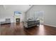 Bright living room featuring hardwood floors, a fireplace, and comfortable seating arrangement at 335 Lee Miller Ct, Suwanee, GA 30024