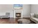 Living room featuring hardwood floors, a fireplace, and comfortable seating at 335 Lee Miller Ct, Suwanee, GA 30024