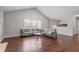Bright and open living room with large windows and vaulted ceilings at 335 Lee Miller Ct, Suwanee, GA 30024