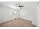 A carpeted bedroom with one window and ceiling fan at 801 N Evelyn Nw, Atlanta, GA 30318