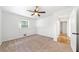 Bedroom features neutral carpet, a ceiling fan, and access to hallway at 801 N Evelyn Nw, Atlanta, GA 30318