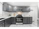 Well-equipped kitchen with sleek cabinetry, stainless appliances, and ample counter space at 801 N Evelyn Nw, Atlanta, GA 30318
