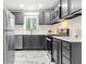 Modern kitchen featuring stainless steel appliances, white countertops, and sleek cabinets at 801 N Evelyn Nw, Atlanta, GA 30318