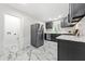 Spacious kitchen with stainless steel appliances, marble floors, and modern cabinets at 801 N Evelyn Nw, Atlanta, GA 30318