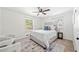 Bright main bedroom with two windows, ceiling fan, and neutral decor at 801 N Evelyn Nw, Atlanta, GA 30318