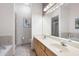 Bathroom featuring double sinks, a large mirror and separate shower and tub at 1605 Ridenour Pkwy, Kennesaw, GA 30152