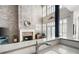 Living room showcasing fireplace, two-story windows and an open view of the kitchen at 1605 Ridenour Pkwy, Kennesaw, GA 30152