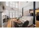 Bright living room with fireplace, open floor plan, and seamless flow to the kitchen at 1605 Ridenour Pkwy, Kennesaw, GA 30152