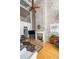 Grand living room with soaring ceilings, exposed brick fireplace, and elegant decor at 1605 Ridenour Pkwy, Kennesaw, GA 30152