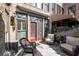 Inviting outdoor patio with comfortable seating, brick wall surround, and charming details at 1605 Ridenour Pkwy, Kennesaw, GA 30152