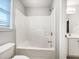 Bathroom featuring a combination tub and shower with a white surround and tiled floor at 200 Pine Trl, Dallas, GA 30157