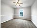 Bright bedroom offers neutral walls, carpet, decorative trim and a ceiling fan for added comfort at 200 Pine Trl, Dallas, GA 30157