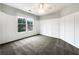 Inviting bedroom features light walls with decoratiive trim, carpet, and a bright window view at 200 Pine Trl, Dallas, GA 30157