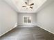 A large bedroom with a tray ceiling. Minimalist design at 200 Pine Trl, Dallas, GA 30157