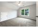Cozy bedroom boasts natural light, neutral walls, carpet, and a ceiling fan for added comfort at 200 Pine Trl, Dallas, GA 30157