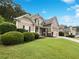 A charming two-story home with a well-manicured lawn and lush landscaping at 200 Pine Trl, Dallas, GA 30157