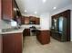 Well-lit kitchen with stainless appliances, granite counters and a central island at 200 Pine Trl, Dallas, GA 30157