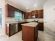 A modern kitchen with stainless steel appliances, granite countertops, and a center island at 200 Pine Trl, Dallas, GA 30157
