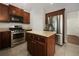 Well-equipped kitchen with stainless steel appliances, granite counters and a convenient center island at 200 Pine Trl, Dallas, GA 30157