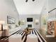 A bright living room featuring a fireplace and stylish decor. (Virtually Staged) at 200 Pine Trl, Dallas, GA 30157