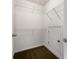 Carpeted walk-in closet with wire shelving and a small door at 200 Pine Trl, Dallas, GA 30157