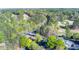 Overhead view of the golf course with bridge and nearby clubhouse and golf course parking at 2001 Towne Lake W Hls, Woodstock, GA 30189