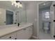 Bathroom with white vanity, stylish sink, and a view into the toilet and shower room at 2001 Towne Lake W Hls, Woodstock, GA 30189