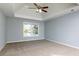 Large bedroom featuring neutral carpet and a ceiling fan at 2001 Towne Lake W Hls, Woodstock, GA 30189