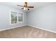 Cozy bedroom featuring a ceiling fan and a sunlit window at 2001 Towne Lake W Hls, Woodstock, GA 30189