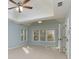 Primary bedroom with cathedral ceiling, large windows, and a ceiling fan at 2001 Towne Lake W Hls, Woodstock, GA 30189