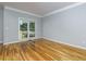 Spacious bedroom features hardwood floors at 2001 Towne Lake W Hls, Woodstock, GA 30189