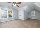Charming bedroom with ceiling fan, double door closet, and windows at 2001 Towne Lake W Hls, Woodstock, GA 30189
