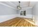 Empty dining room featuring chair rail and modern chandelier at 2001 Towne Lake W Hls, Woodstock, GA 30189