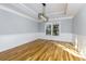 Dining space features hardwood floors, white wainscoting and modern light fixture at 2001 Towne Lake W Hls, Woodstock, GA 30189
