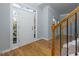 Bright foyer with hardwood floors and staircase at 2001 Towne Lake W Hls, Woodstock, GA 30189