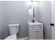 Neutral-toned half bath with modern sink and fixtures at 2001 Towne Lake W Hls, Woodstock, GA 30189