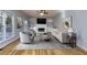 Inviting living room with fireplace, built-ins, large windows and hardwood floors at 2001 Towne Lake W Hls, Woodstock, GA 30189