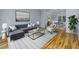 Stylishly furnished living room with hardwood floors at 2001 Towne Lake W Hls, Woodstock, GA 30189