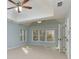 Neutral main bedroom featuring tray ceilings, carpet and large windows at 2001 Towne Lake W Hls, Woodstock, GA 30189