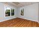Bright office space with wood floors and natural light streaming through large windows at 2001 Towne Lake W Hls, Woodstock, GA 30189