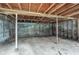 Unfinished basement with concrete floor and exposed wood ceiling beams at 2475 Harvel Nw Dr, Atlanta, GA 30318