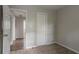 This bedroom features carpeted floors at 2475 Harvel Nw Dr, Atlanta, GA 30318