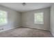 This carpeted bedroom features two windows at 2475 Harvel Nw Dr, Atlanta, GA 30318