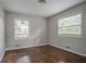 This bedroom has two windows and hardwood floors at 2475 Harvel Nw Dr, Atlanta, GA 30318