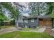 Two-story home exterior with brick and siding, paved driveway, and carport at 2475 Harvel Nw Dr, Atlanta, GA 30318