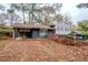 Charming split level home with red door, painted brick and a covered side entrance at 2475 Harvel Nw Dr, Atlanta, GA 30318